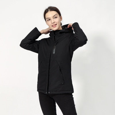 DEFROST - Heated Jacket in black worn by a woman